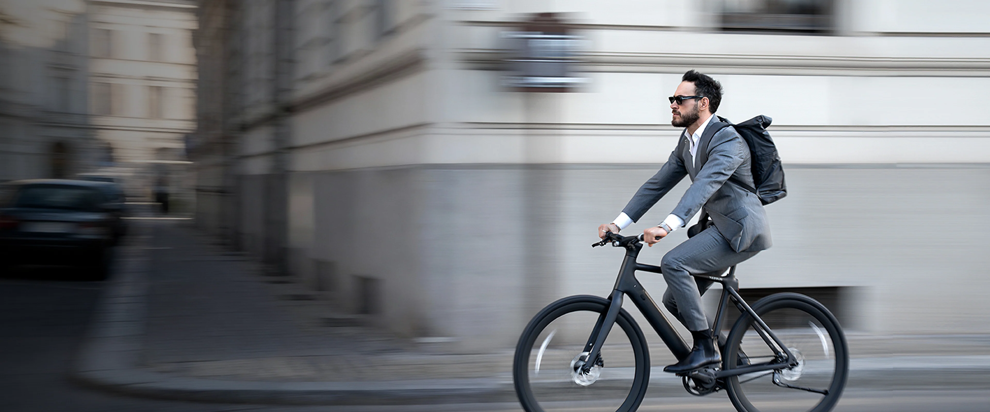 A professional commuting through the city on a Tezeus e-bike