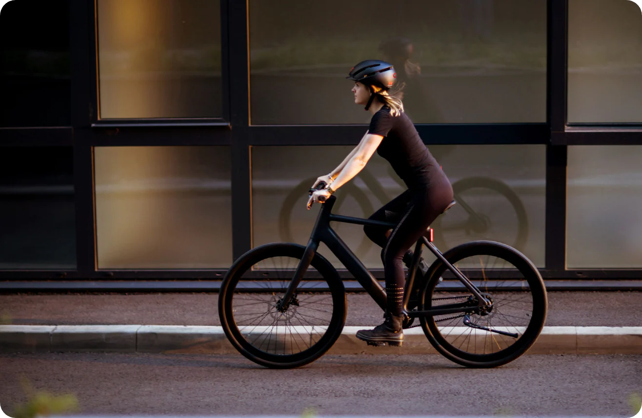 A cyclist riding a Tezeus e-bike through the city